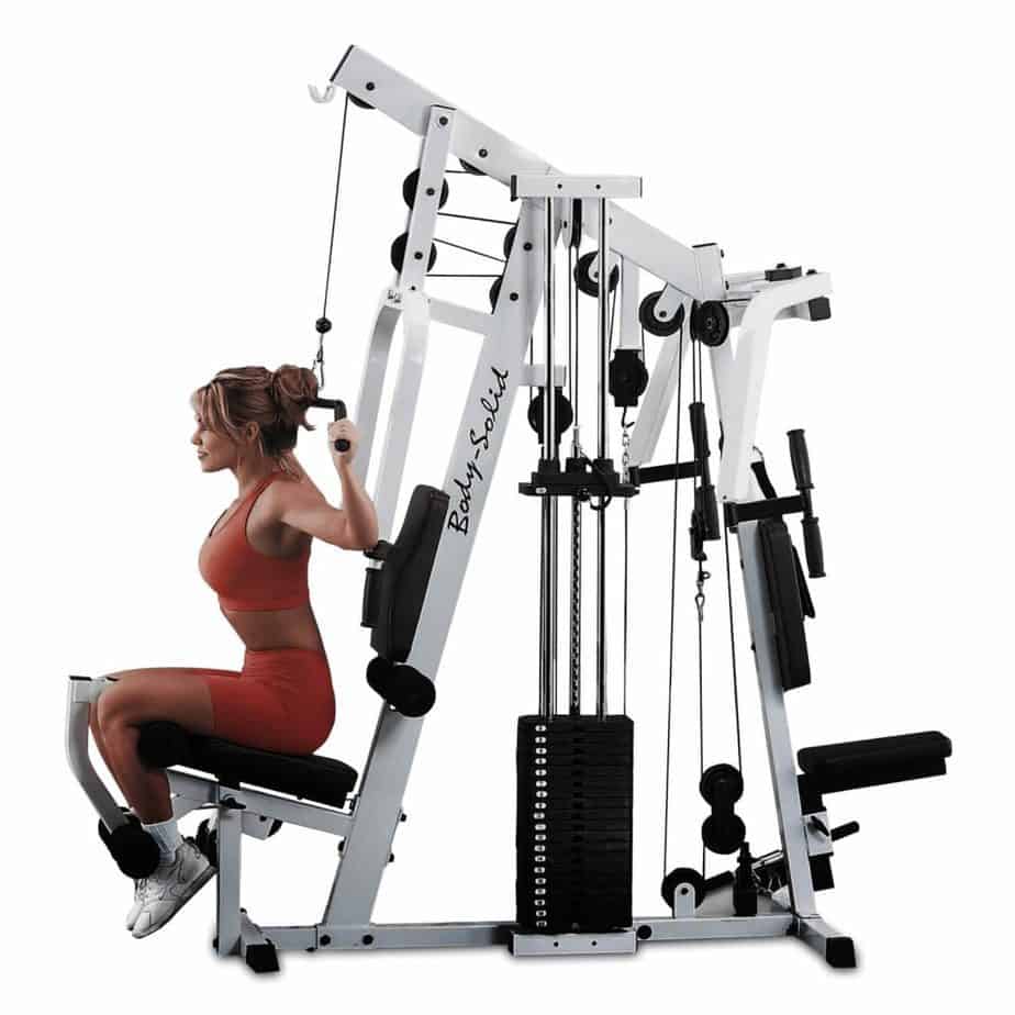 Body-Solid Strength Tech EXM2500S Home Gym is being used by a lady