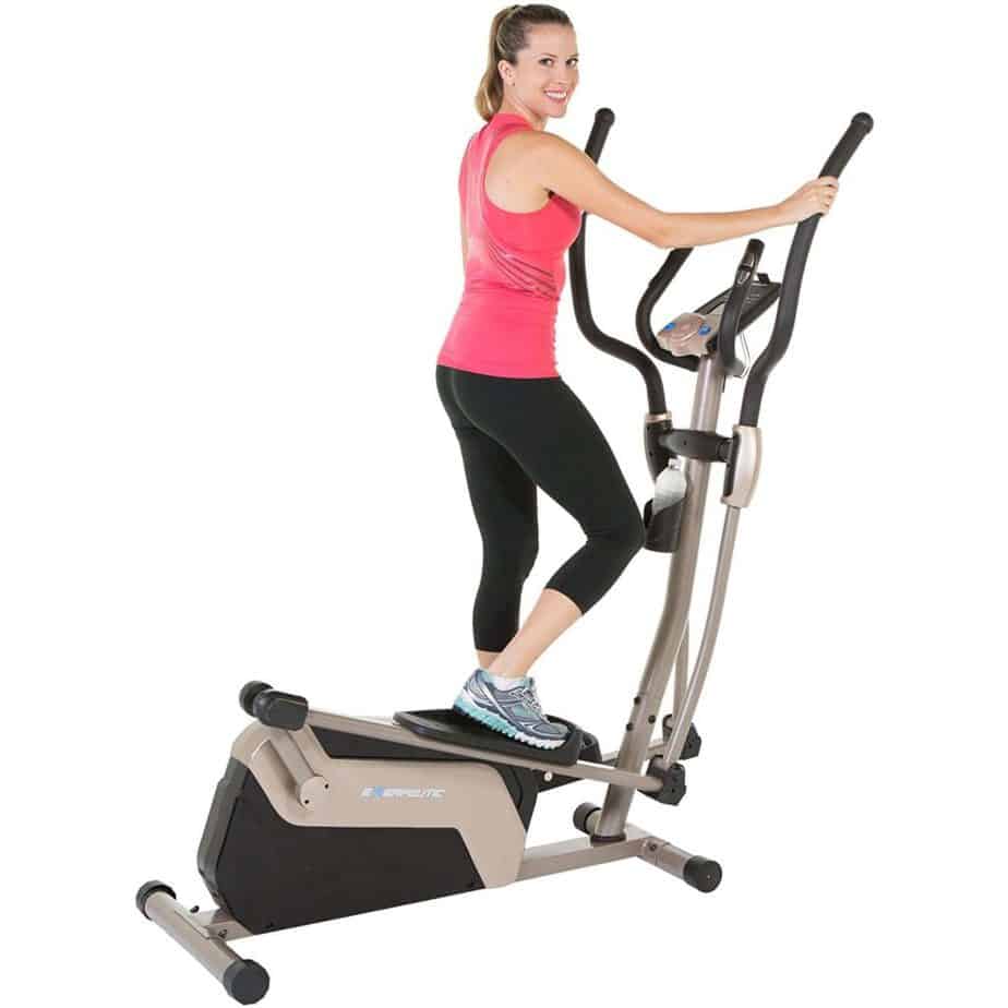 A lady is working out on the Exerpeutic 1318 5000 Magnetic Elliptical Trainer