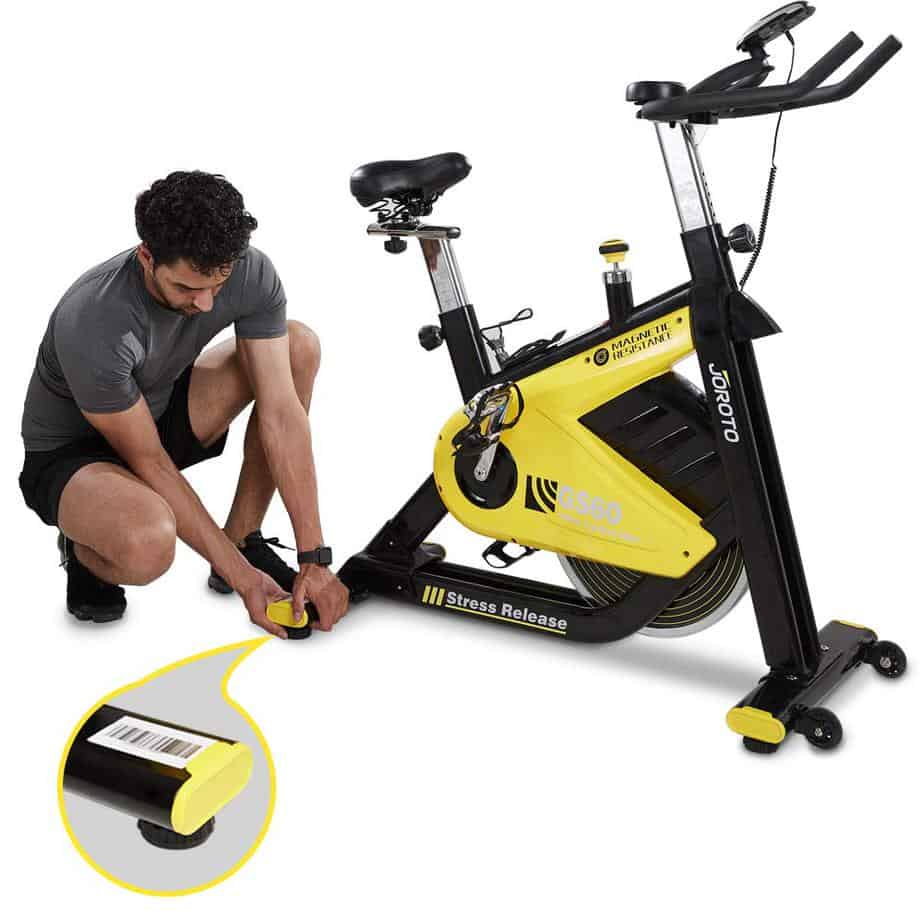 GS60 JOROTO Indoor Cycling Bike being adjusted by the user