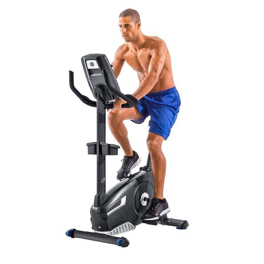 Nautilus U618 Upright Bike (Model 100653) is ridden by a male athlete