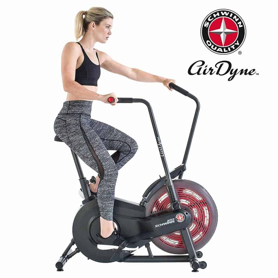 A lady athlete is riding the Schwinn AD2 Airdyne Bike