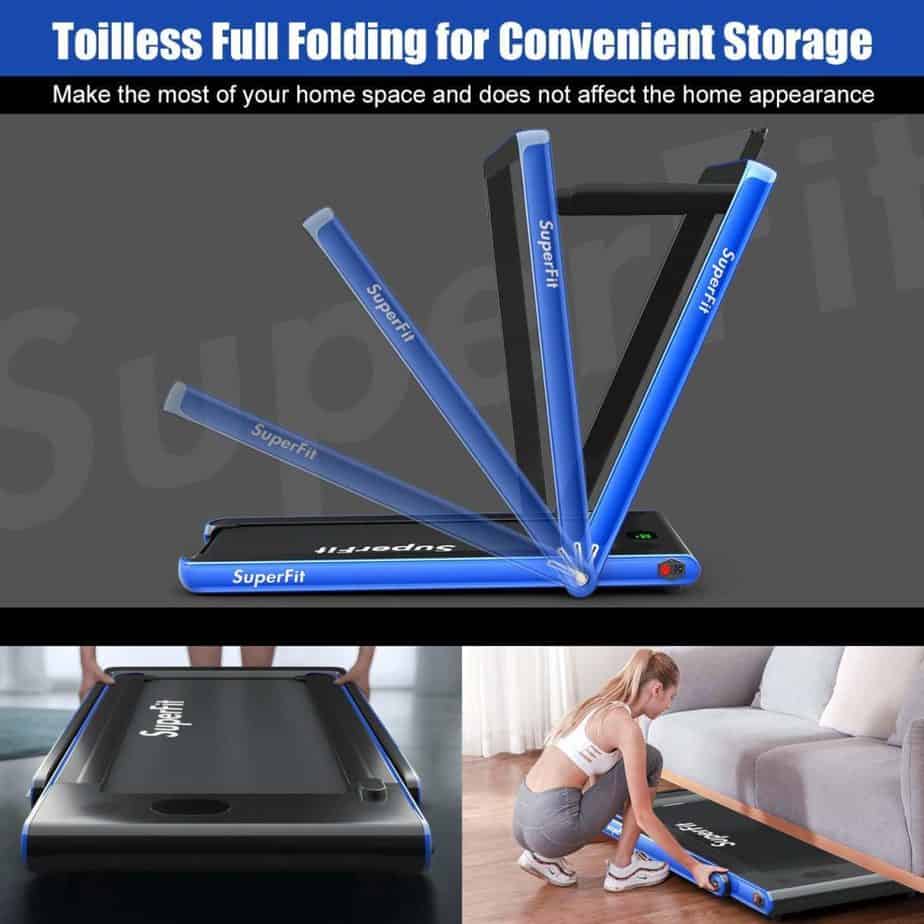 The Goplus 2 in 1 Folding Treadmill being folded and stored under the couch by a lady