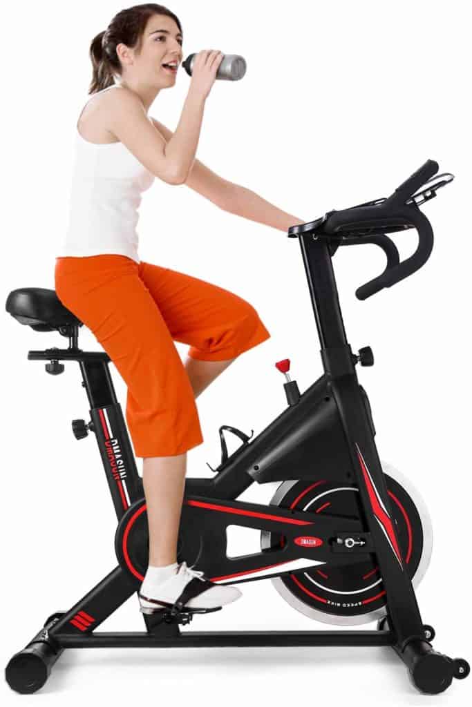 DMASUN Exercise Stationary Bike is being ridden by a woman