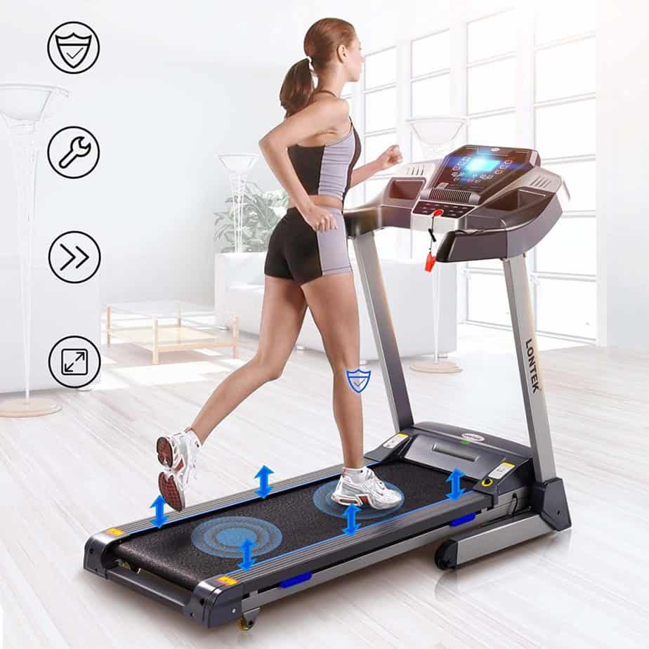 A lady is exercising on the UMAY Bluetooth Motorized Treadmill