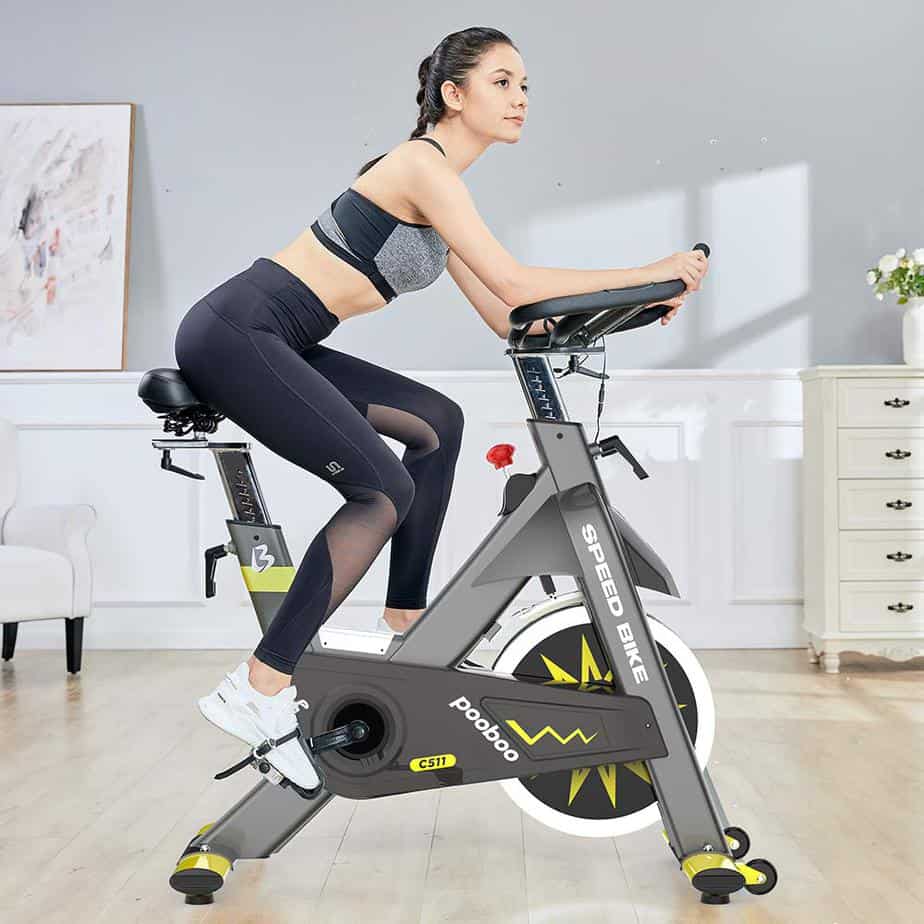 A lady is riding the Pooboo C511 Commercial Cycling Bike