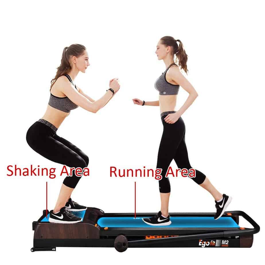 A lady jogs and uses the vibration platform on the Egofit M2 Treadmill