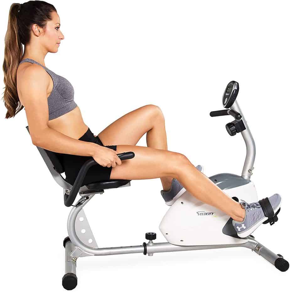 A lady is exercising with the Velocity Exercise CHB-R2102 Recumbent Bike