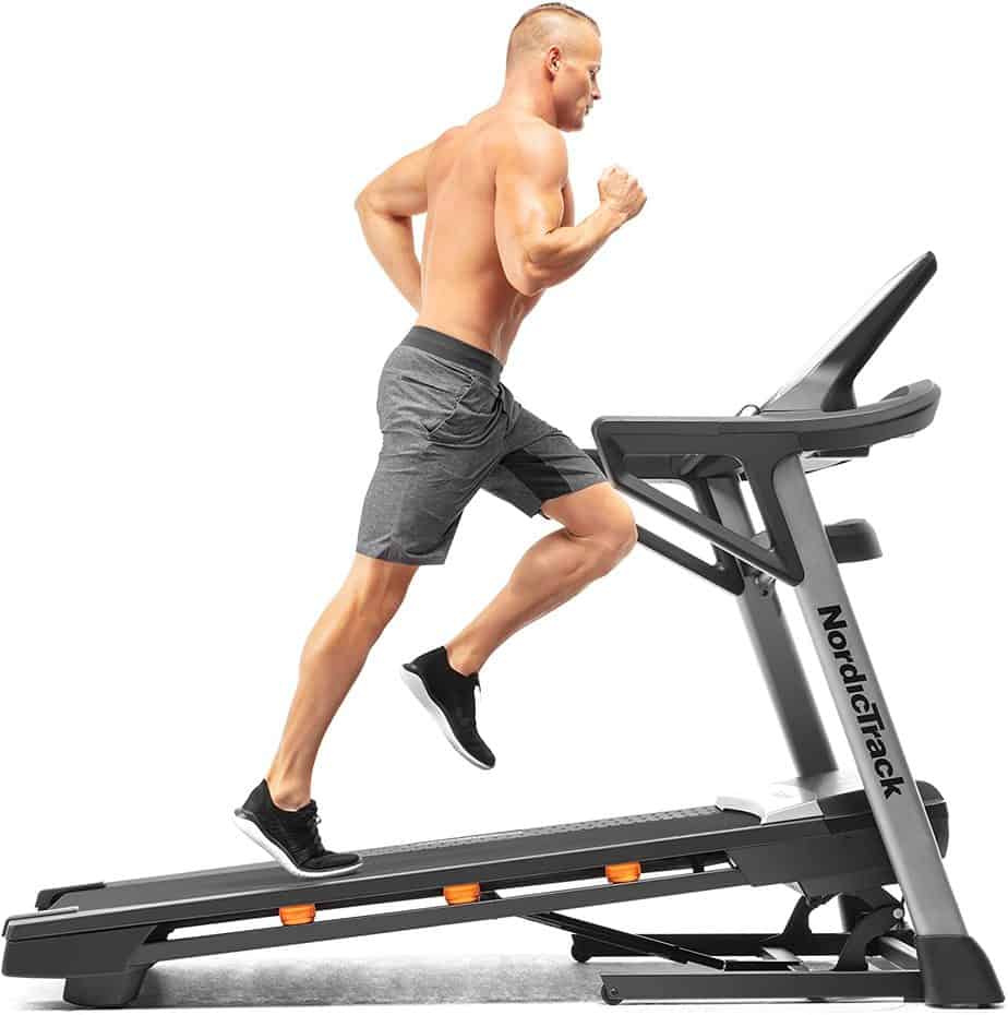 An athlete is running on the Nordic Track T 7.5 S Treadmill