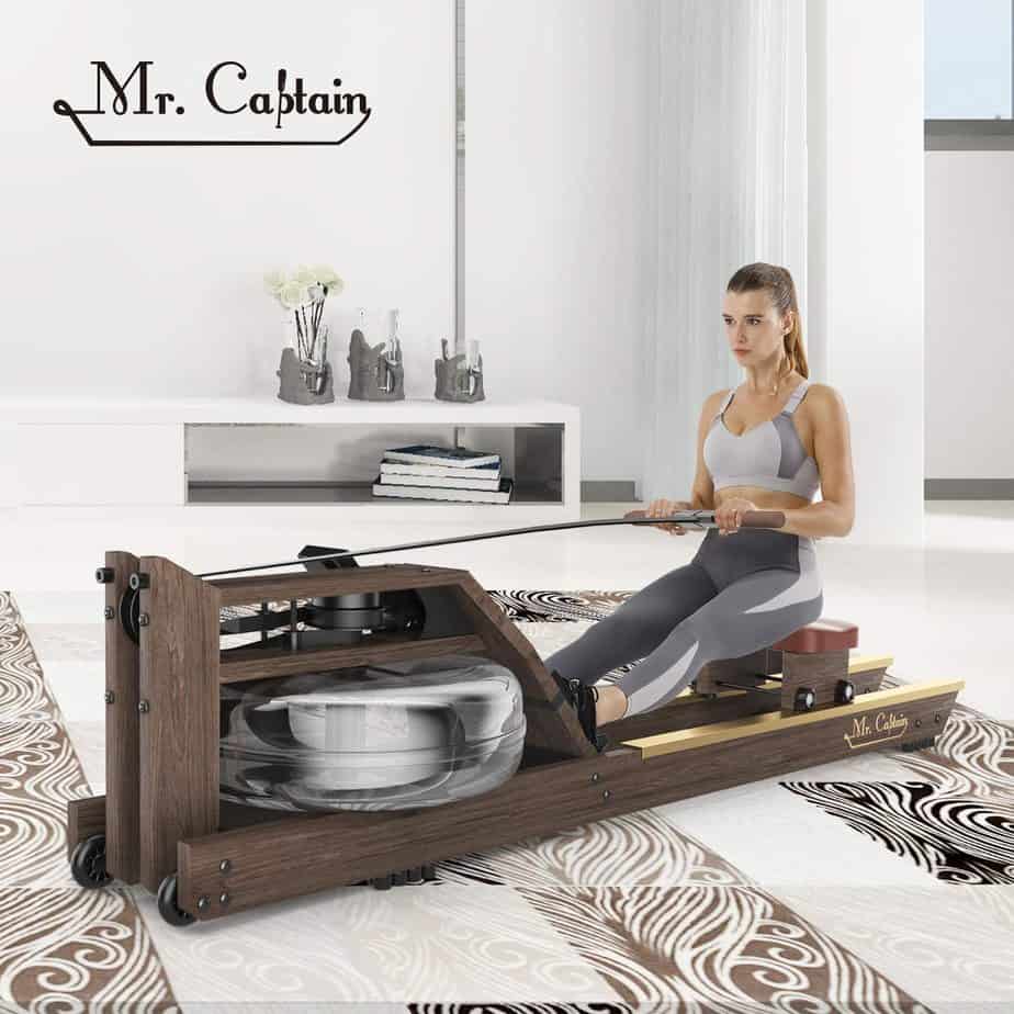 A lady athlete is exercing with the Mr. Captain Water Rowing Machine