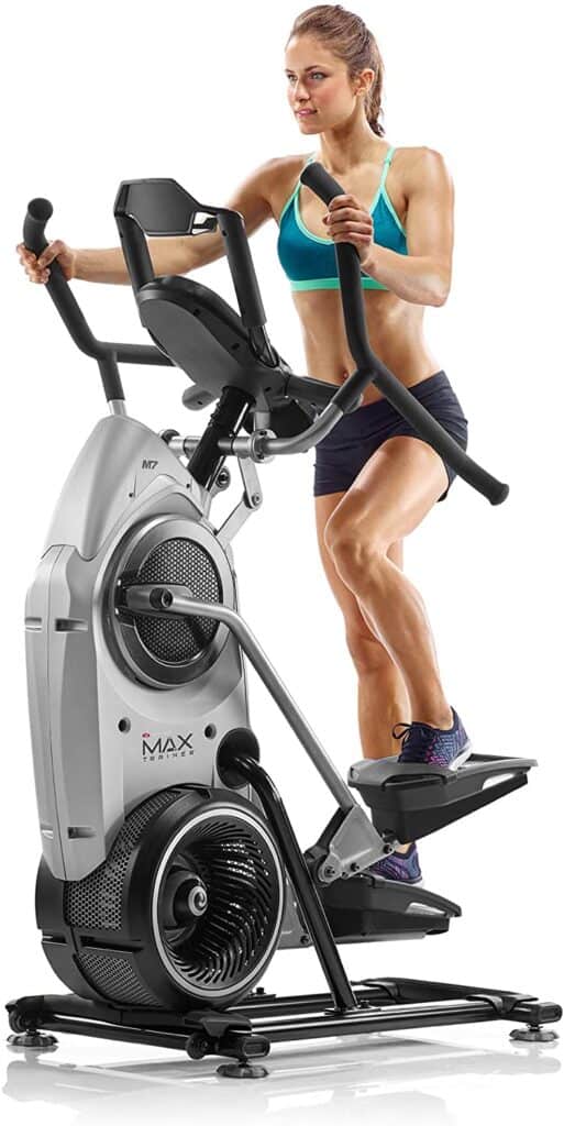 A lady works out on the Bowflex Max Trainer M7