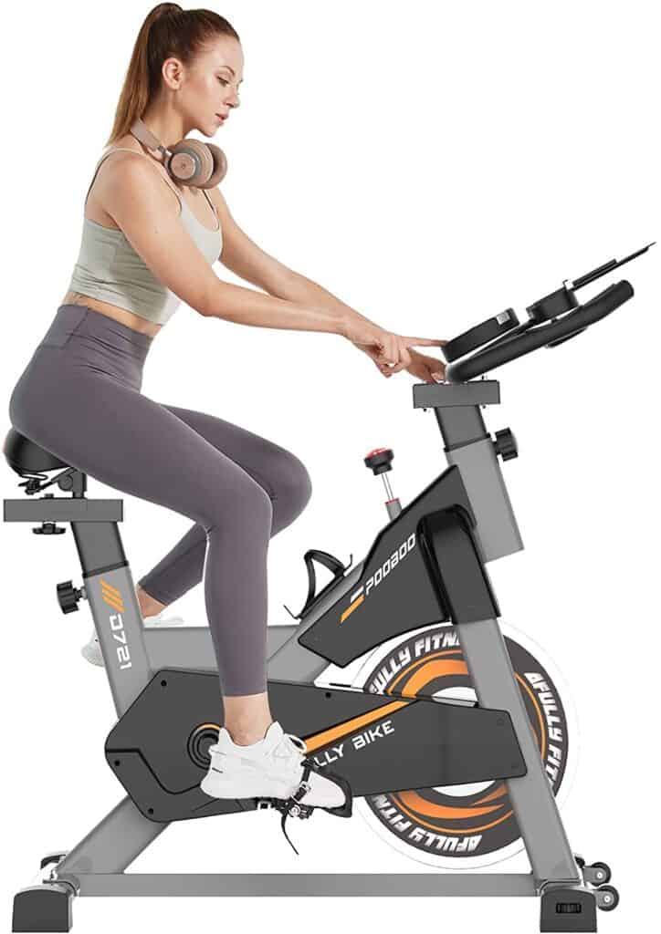 A lady exercises with the Pooboo S2 D721 Indoor Cycling Bike