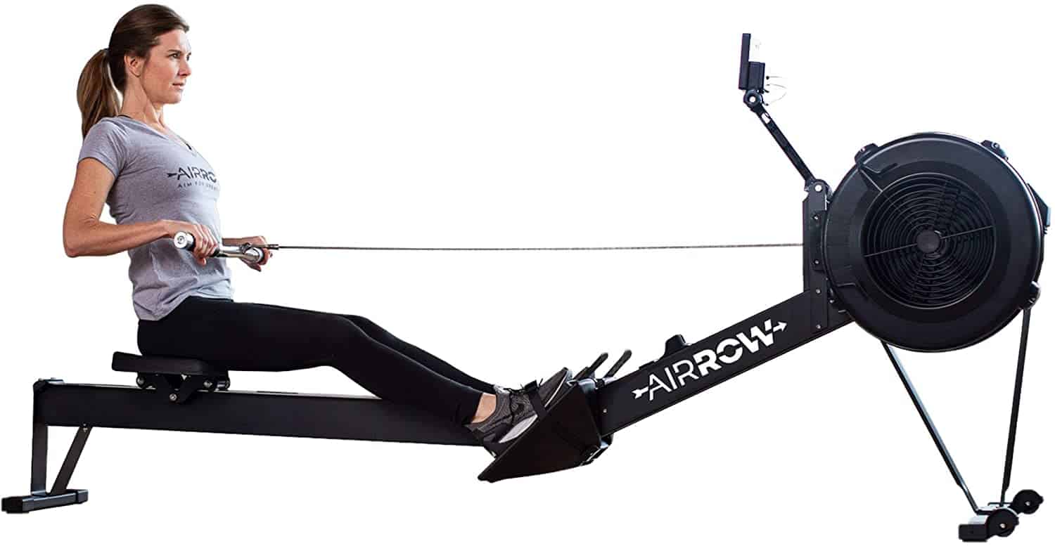 A lady rows on the AirRow Fitness Rowing Machine