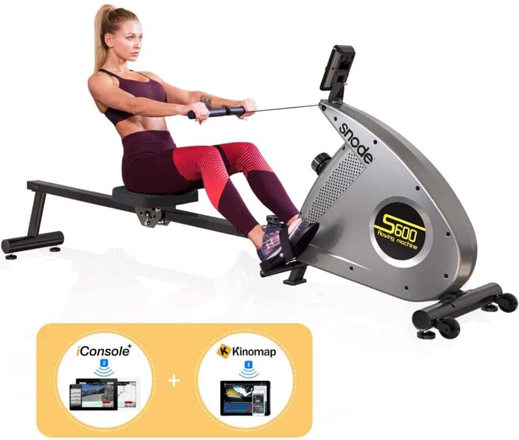 A lady is exercising with the SNODE S600 Bluetooth Magnetic Rowing Machine