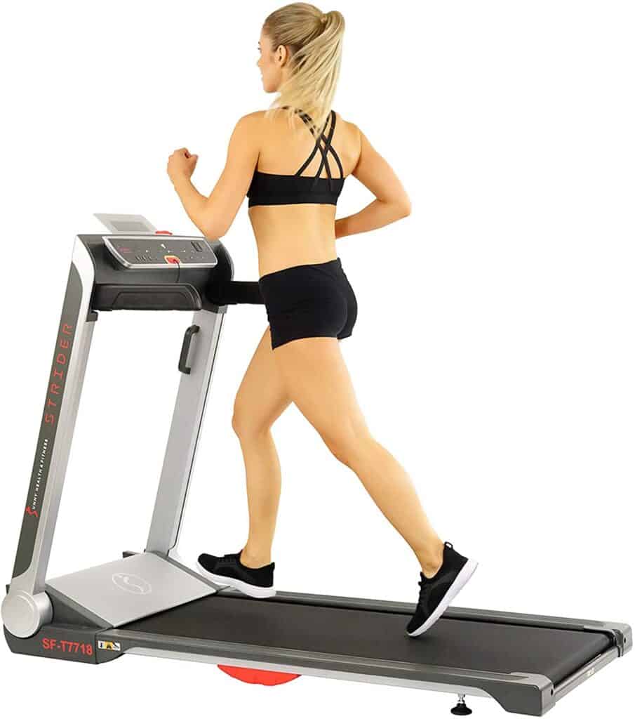 A lady exercises on the Sunny Health & Fitness SF-T7718 Electric Treadmill