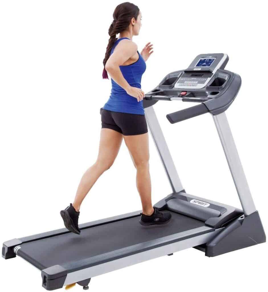 A lady runs on the Spirit Fitness XT185 Folding Treadmill