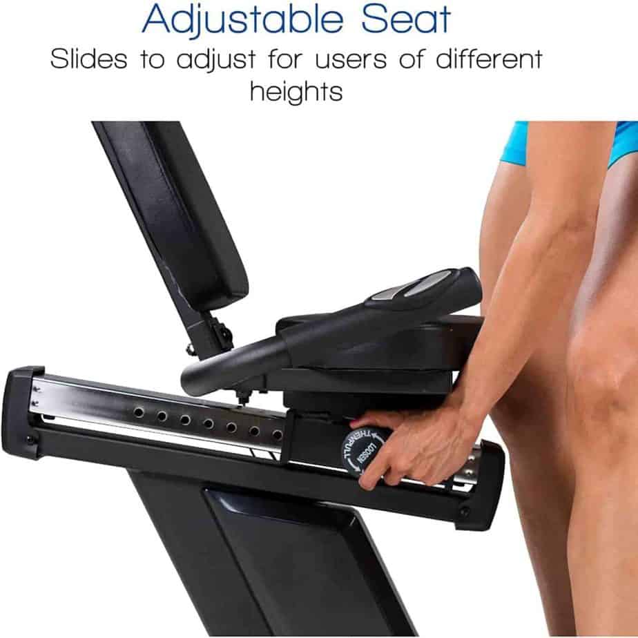 A user adjusts the seat of the XTERRA SB2.5R Exercise Recumbent Bike 