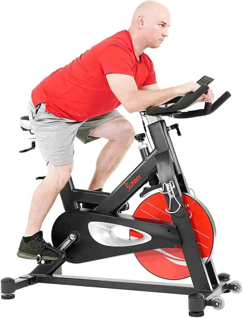 A man rides the Sunny Health & Fitness SF-B1986 Evolution Pro II Cycling Bike