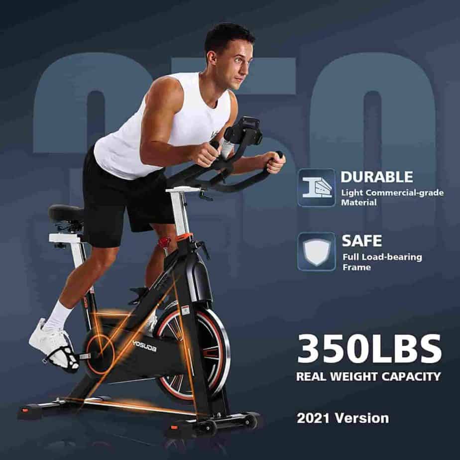 An athlete rides the YOSUDA L-010 Pro Magnetic Exercise Bike 