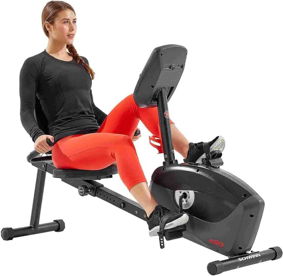 A lady exercises with the Schwinn A20 Recumbent Bike