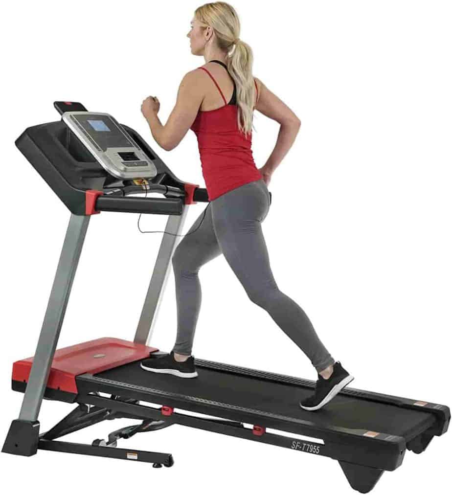 A lady runs on the Sunny Health & Fitness Evo-Fit SF-T7955 Treadmill 