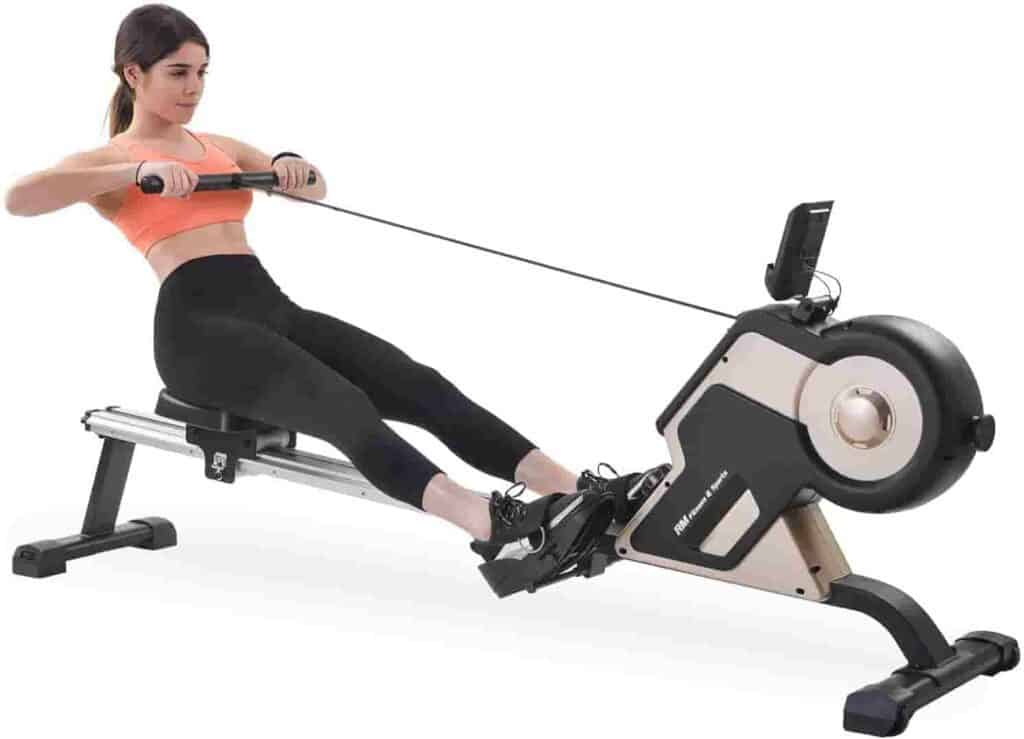 A lady exercises with the Merax Silver Magnetic Rowing Machine
