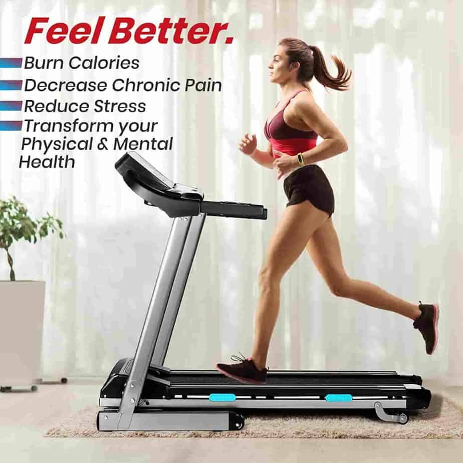 A lady runs on the SereneLife SLFTRD35 Foldable Treadmill 