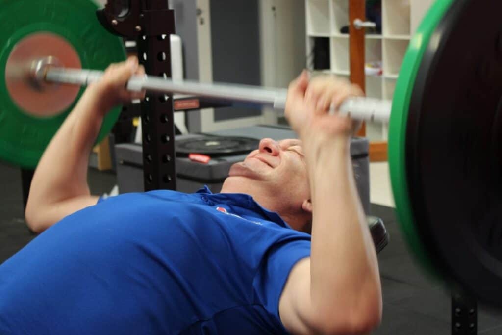 Man does bench press