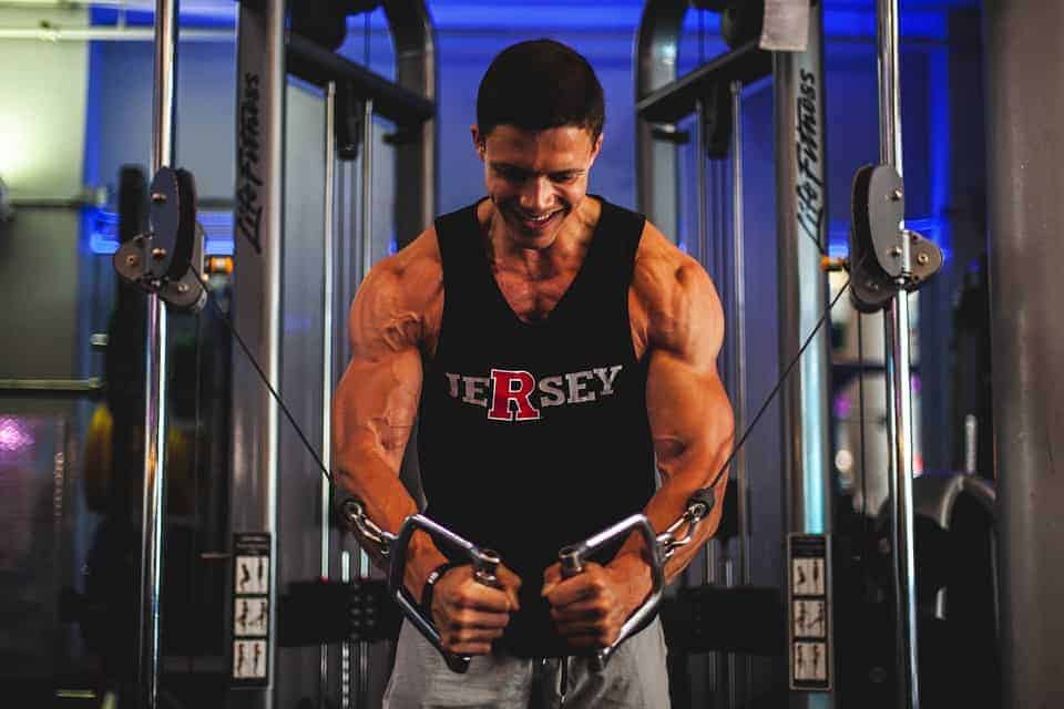 Man builds the muscle at the gym