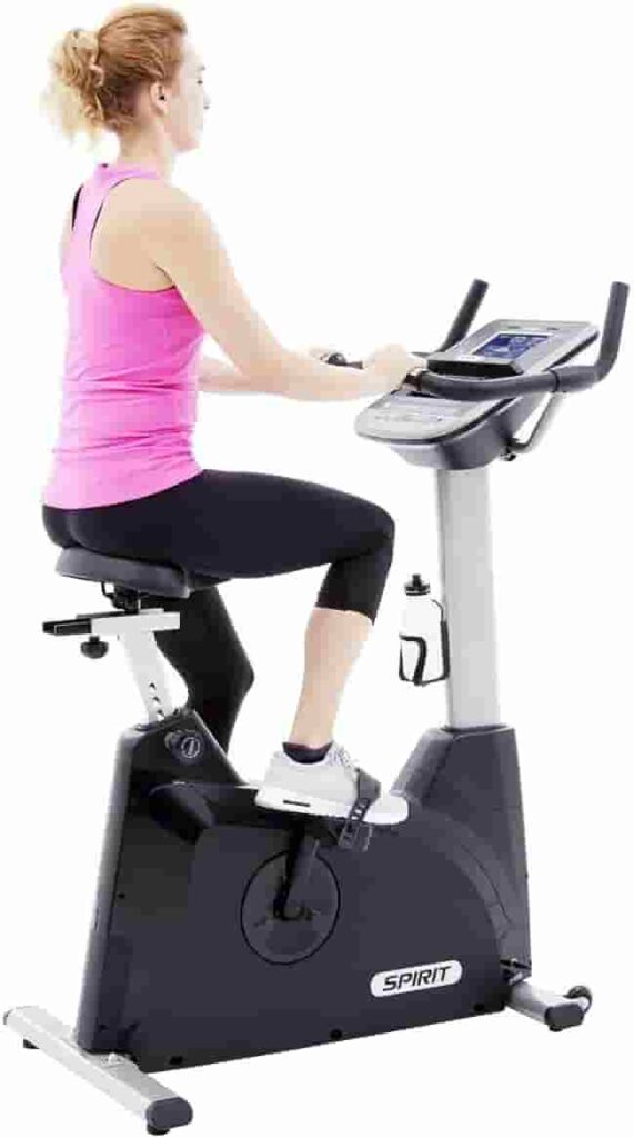 A lady workouts with the Spirit Fitness XBU55 Upright Bike