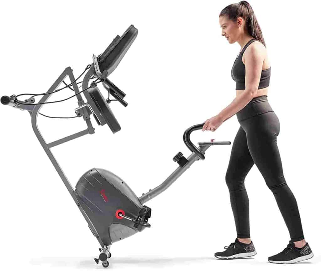 User moves the Sunny Health & Fitness Interactive SF-RB420031 Recumbent Bike to storage