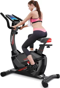 A lady exercises on the Harison B6 Upright Exercise Bike