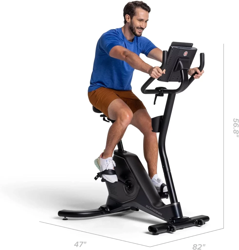 A man exercises with th e Schwinn 190 Upright Bike