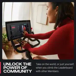 The lady opeartes the display of the Peloton BA01-DC04 Indoor Cycling Bike