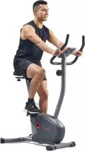 A man rides the Sunny Health & Fitness SF-B220030 Upright Bike