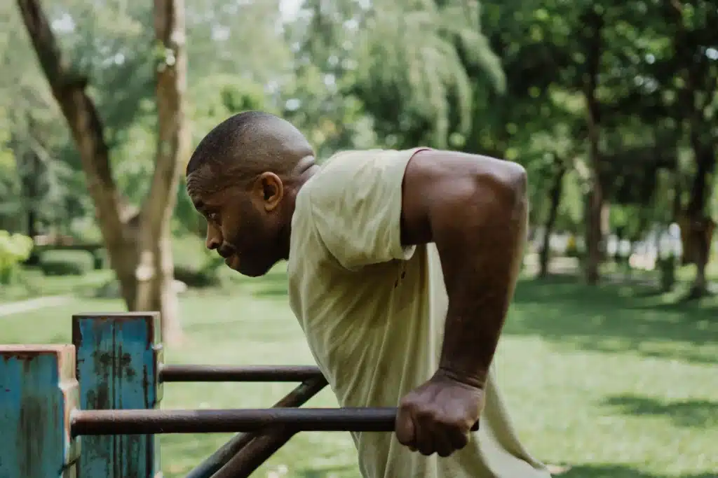 A man performs dip exercises
